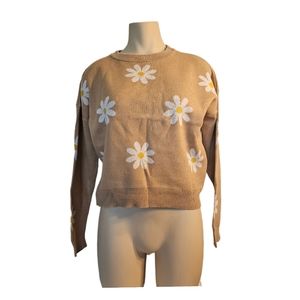 This shirt is tan color white yellow flowers The shirt is in good condition